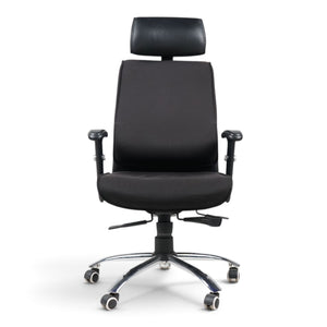 Refurnish by Loopr black ergonomic office chair with headrest, adjustable armrests, and chrome base on wheels.
