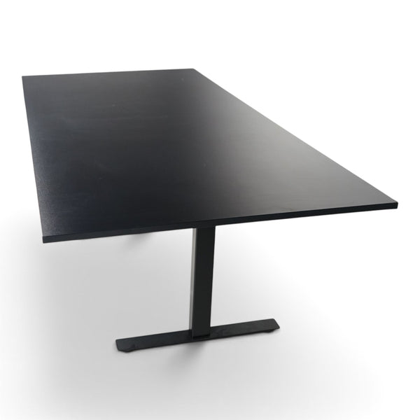 Refurnish by Loopr black rectangular meeting table measuring 240x120 cm with a minimalist pedestal base