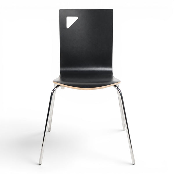 Refurnish by Loopr black stackable chair with a cutout detail in the backrest and slim chrome metal legs