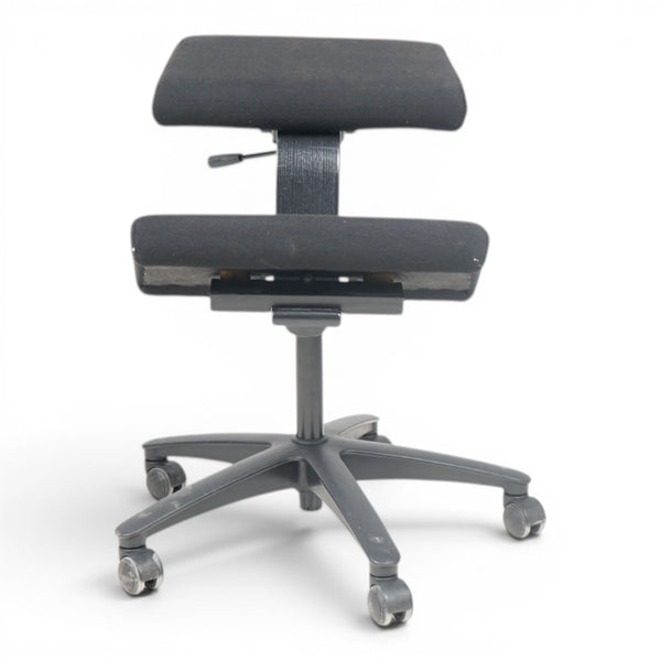 Refurnish by Loopr black ergonomic kneeling chair with adjustable seat and backrest, ideal for active sitting.
