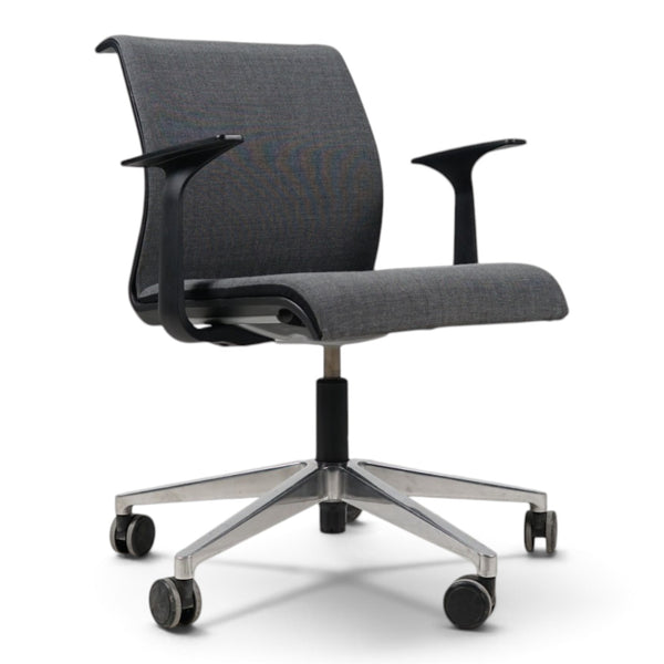 Refurnish by Loopr grey fabric office chair with armrests, adjustable height, and a five-star base with wheels.