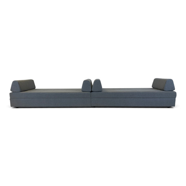 Refurnish by Loopr grey fabric sofa bed in flat sleeping position with two backrest cushions on a white background