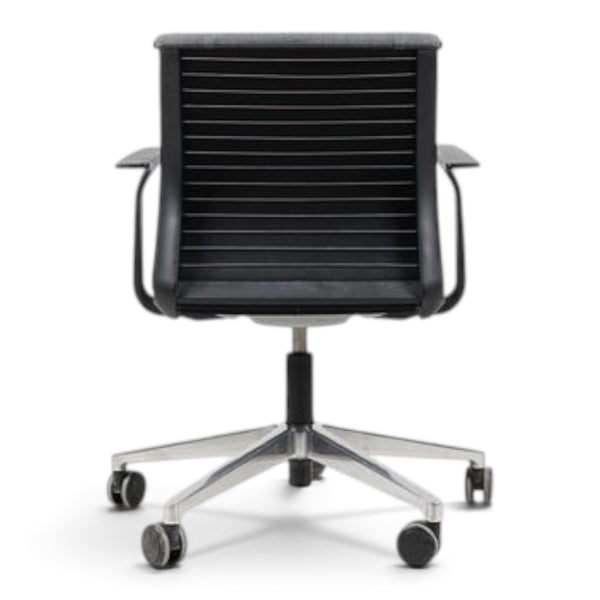 Refurnish by Loopr grey office chair with armrests and a ribbed backrest, viewed from the back on a wheeled base.