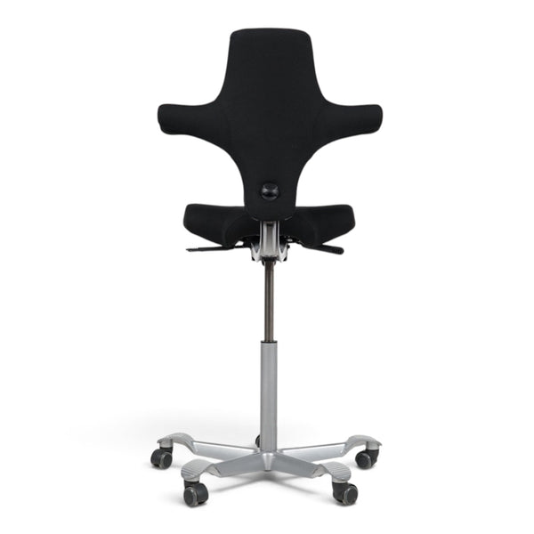 Refurnish by Loopr HÅG Capisco 8106 ergonomic office chair with black saddle seat and silver base, rear view