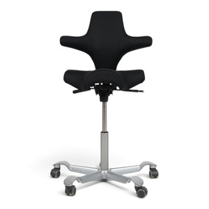 Refurnish by Loopr HÅG Capisco 8106 ergonomic office chair with black saddle seat and silver grey base