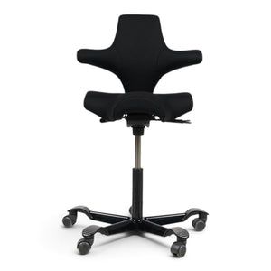 Refurnish by Loopr HÅG Capisco 8106 ergonomic office chair with a black saddle seat and black five-star base.