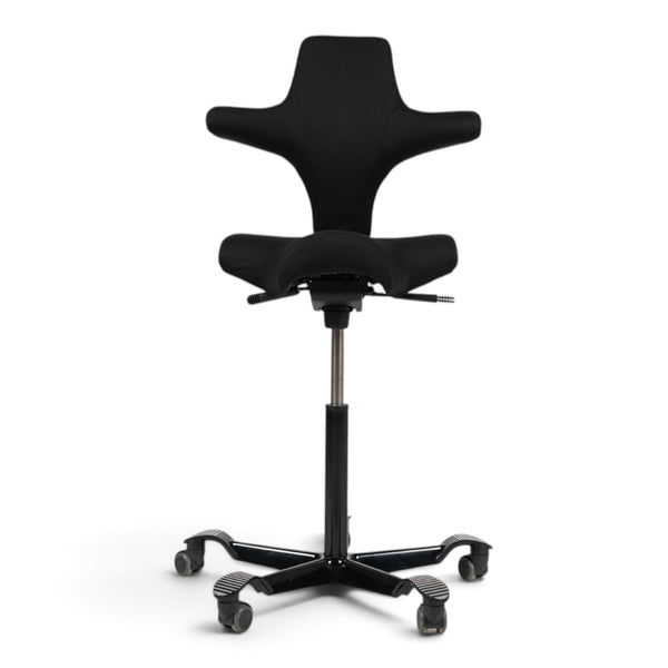 Refurnish by Loopr HÅG Capisco 8107 ergonomic office chair in black fabric with a high-adjustment base.