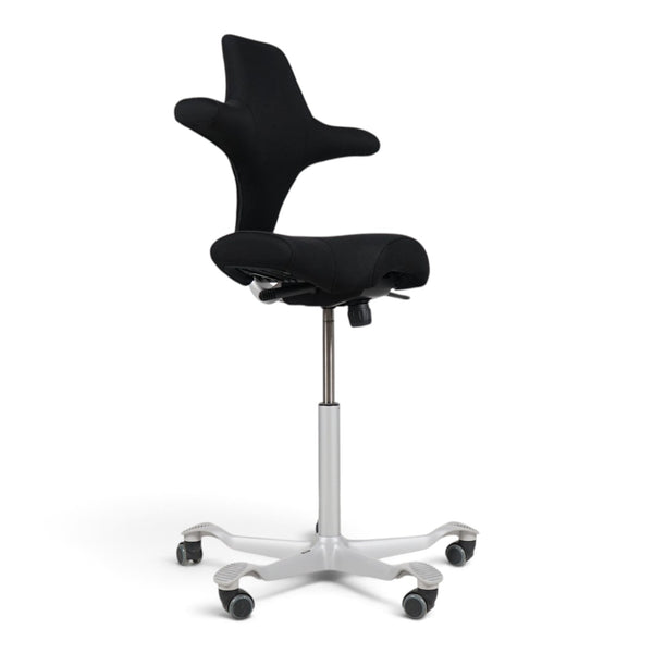 Refurnish by Loopr HÅG Capisco 8106 ergonomic office chair with black saddle seat and grey base on white background