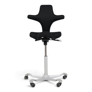 Refurnish by Loopr HÅG Capisco 8106 ergonomic office chair with black saddle seat and grey base on a white background
