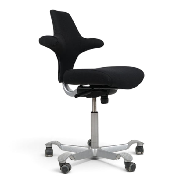 Refurnish by Loopr HÅG Capisco 8106 ergonomic office chair with black saddle seat and silver grey five-arm base