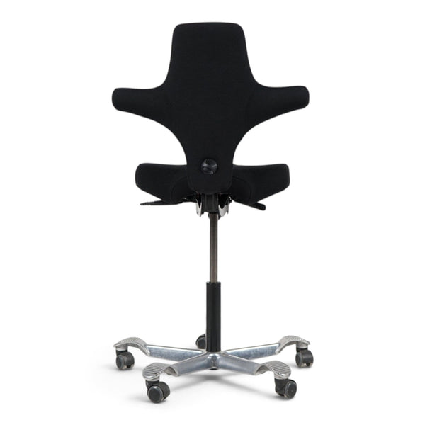 Refurnish by Loopr HÅG Capisco 8106 office chair with a black upholstered seat and silver five-star base