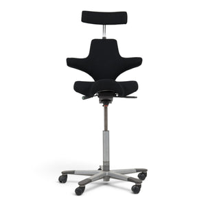 Refurnish by Loopr HÅG Capisco office chair with black seat, headrest, and grey base on wheels.