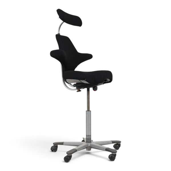 Refurnish by Loopr HÅG Capisco office chair with black seat, headrest, and grey base, side view