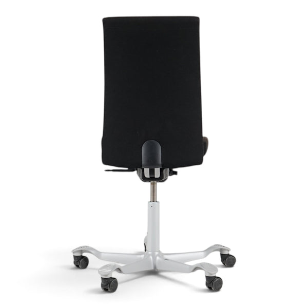 Refurnish by Loopr HÅG Creed 6006 ergonomic office chair in black fabric with a grey base, viewed from the back.