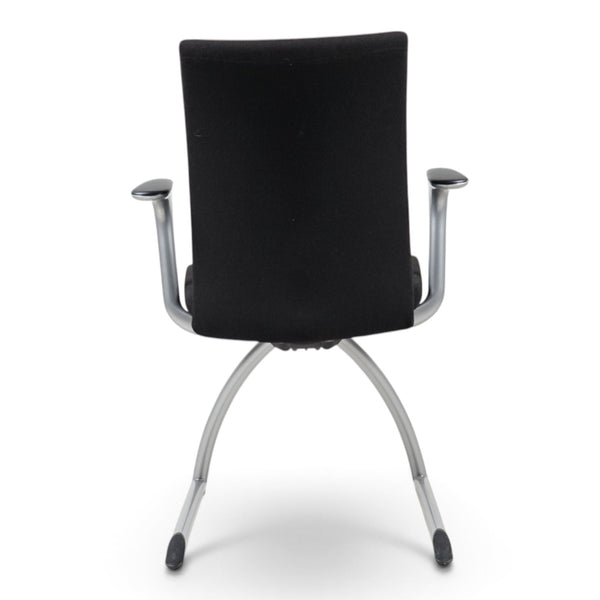 Refurnish by Loopr HÅG H04 4470 black conference chair with upholstered back and silver metal frame, rear view