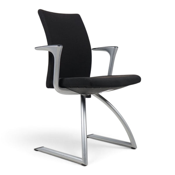 Refurnish by Loopr HÅG H04 4470 black upholstered conference chair with a sleek silver metal cantilever frame.