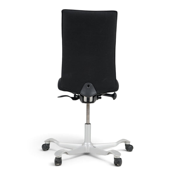 Refurnish by Loopr HÅG H05 ergonomic office chair in black fabric with a grey five-star base, rear view.