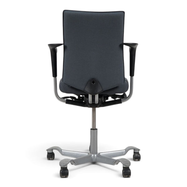 Refurnish by Loopr HÅG H05 5400 office chair in grey fabric with armrests and a silver-grey base, rear view.