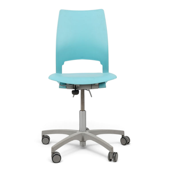 Refurnish by Loopr Kinnarps conference chair in light blue with a swivel base and wheels, armless design.