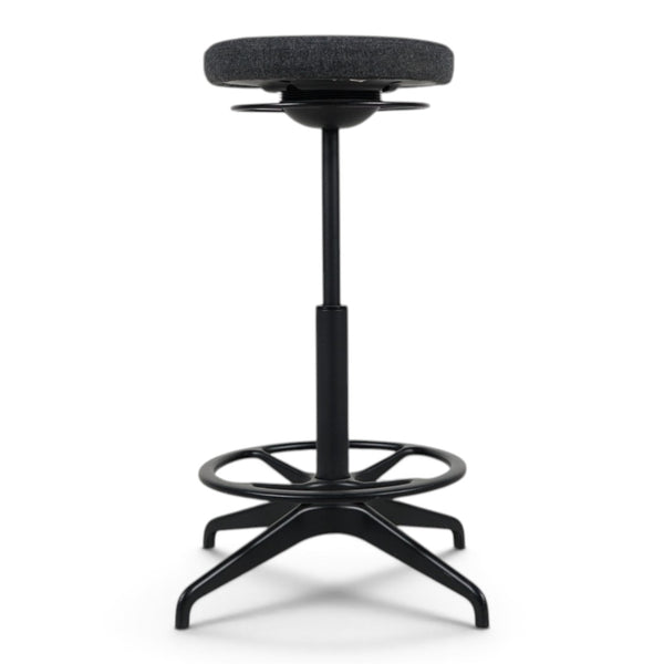 Refurnish by Loopr IKEA LIDKULLEN active sit-stand stool with a dark grey Gunnared fabric seat and black metal base.