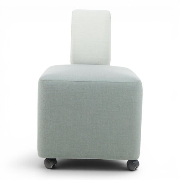 Refurnish by Loopr light blue upholstered ottoman with a half-back and wheels.
