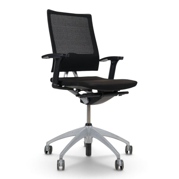 Refurnish by Loopr ergonomic Sedus office chair in black with mesh back, adjustable armrests, and grey base