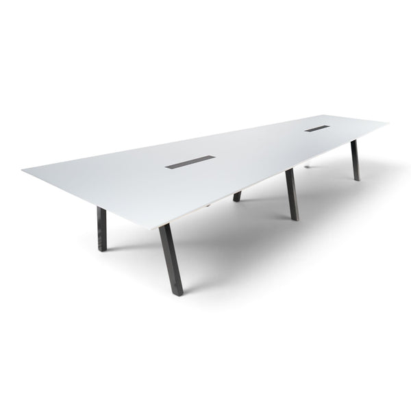 Refurnish by Loopr Svenheim trapezoid conference table with a white top and black metal legs for large meeting rooms.