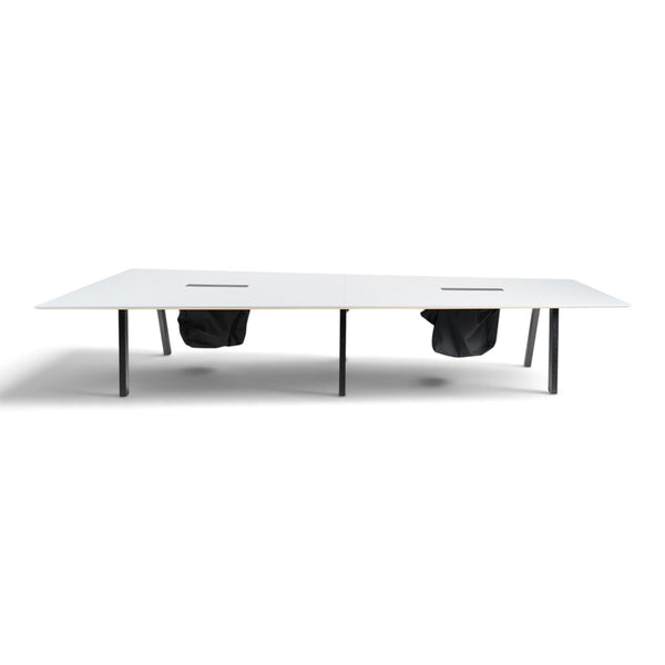 Refurnish by Loopr Svenheim trapezoid conference table with a white top and black metal legs for large boardrooms.