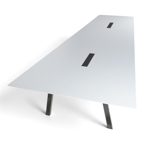 Refurnish by Loopr trapezoid meeting table with a white top and black legs, designed for large conference rooms.