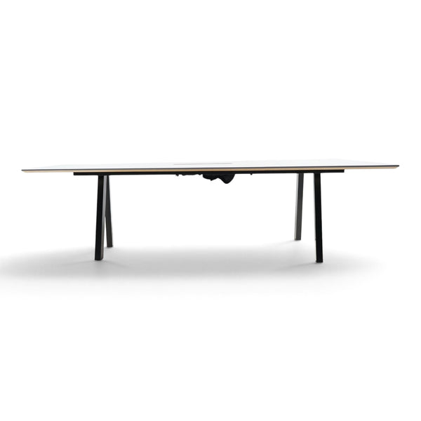 Refurnish by Loopr trapezoid meeting table with a white top and black metal frame for office conference rooms