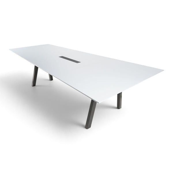 Refurnish by Loopr trapezoid meeting table with a white top and black legs, designed for optimal screen viewing.